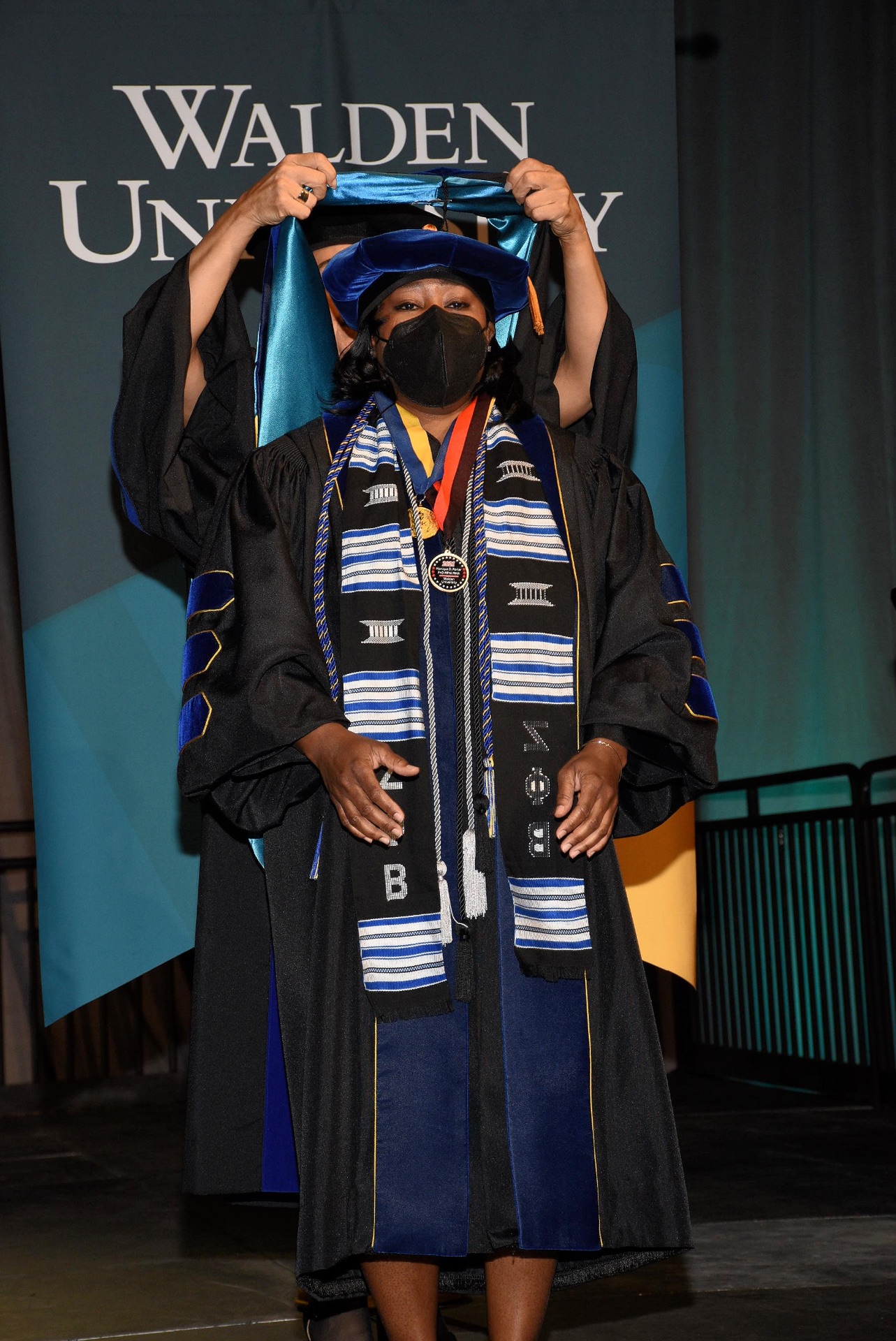 Dr. Mo celebrating her doctoral commencement at Walden University